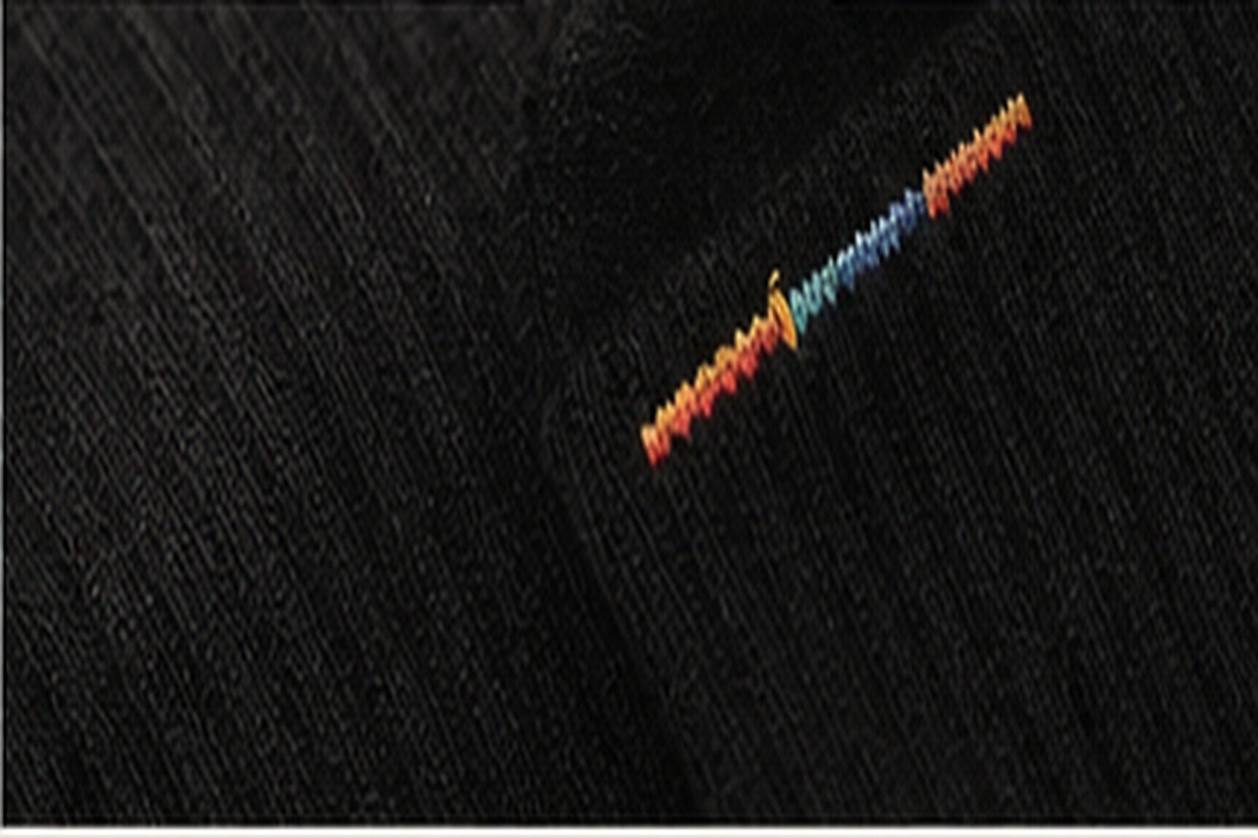 Small signal detail on black sock